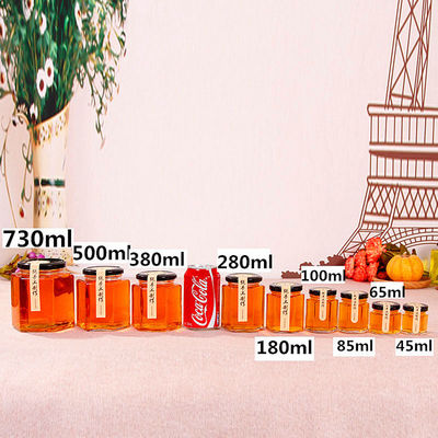 Hexagon Clear Glass Storage Bottle 100ml 500ml Dengan Tutup Logam Untuk Krim Madu