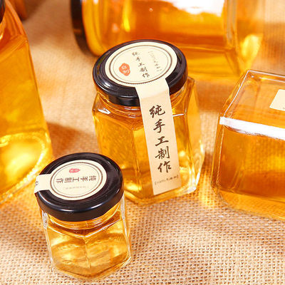Hexagon Clear Glass Storage Bottle 100ml 500ml Dengan Tutup Logam Untuk Krim Madu